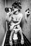 Girl on toilet drinking Girl on toilet drinking