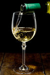 White wine pouring into glass White wine pouring into glass